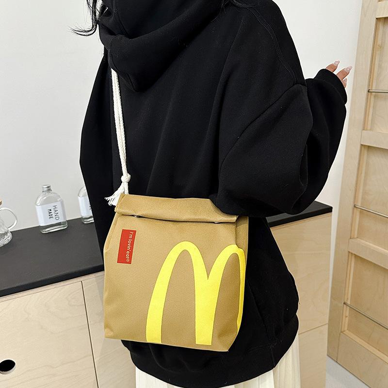 Interesting McDonald's large capacity canvas backpack, cute personalized shoulder messenger bag casual canvas backpack notebook bag, suitable for vacation, shopping, groceries